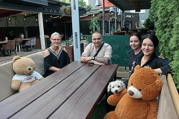The family behind Priča, in the restaurant garden